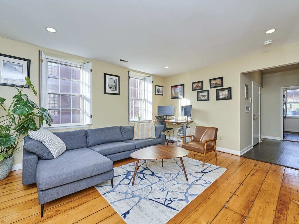 65 Pinckney Street, Unit 3 Boston, MA 02114 - Photo 2 of 14 a living room with furniture and wooden floor