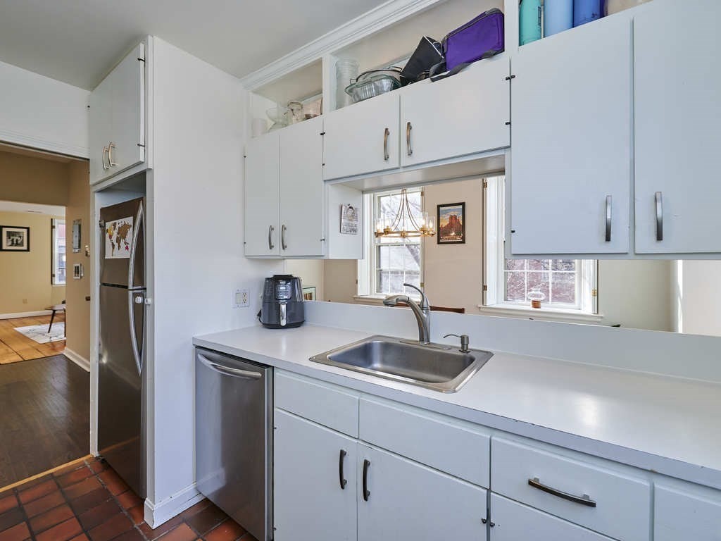 65 Pinckney Street, Unit 3 Boston, MA 02114 - Photo 6 of 14 a kitchen with stainless steel appliances white cabinets and a sink