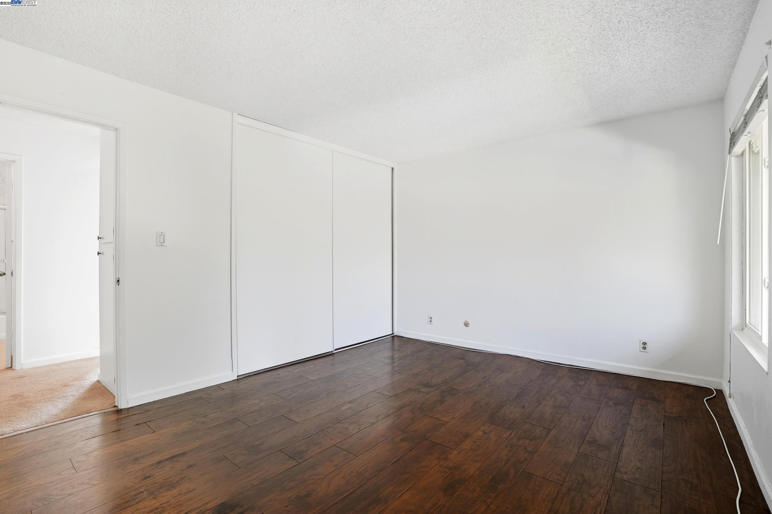 2067 Olivera Road, Unit B Concord, CA 94520 - Photo 13 of 23 an empty room with wooden floor