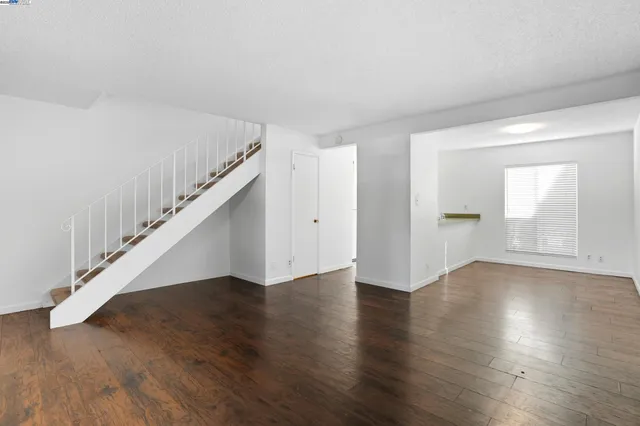 a view of an entryway with wooden floor