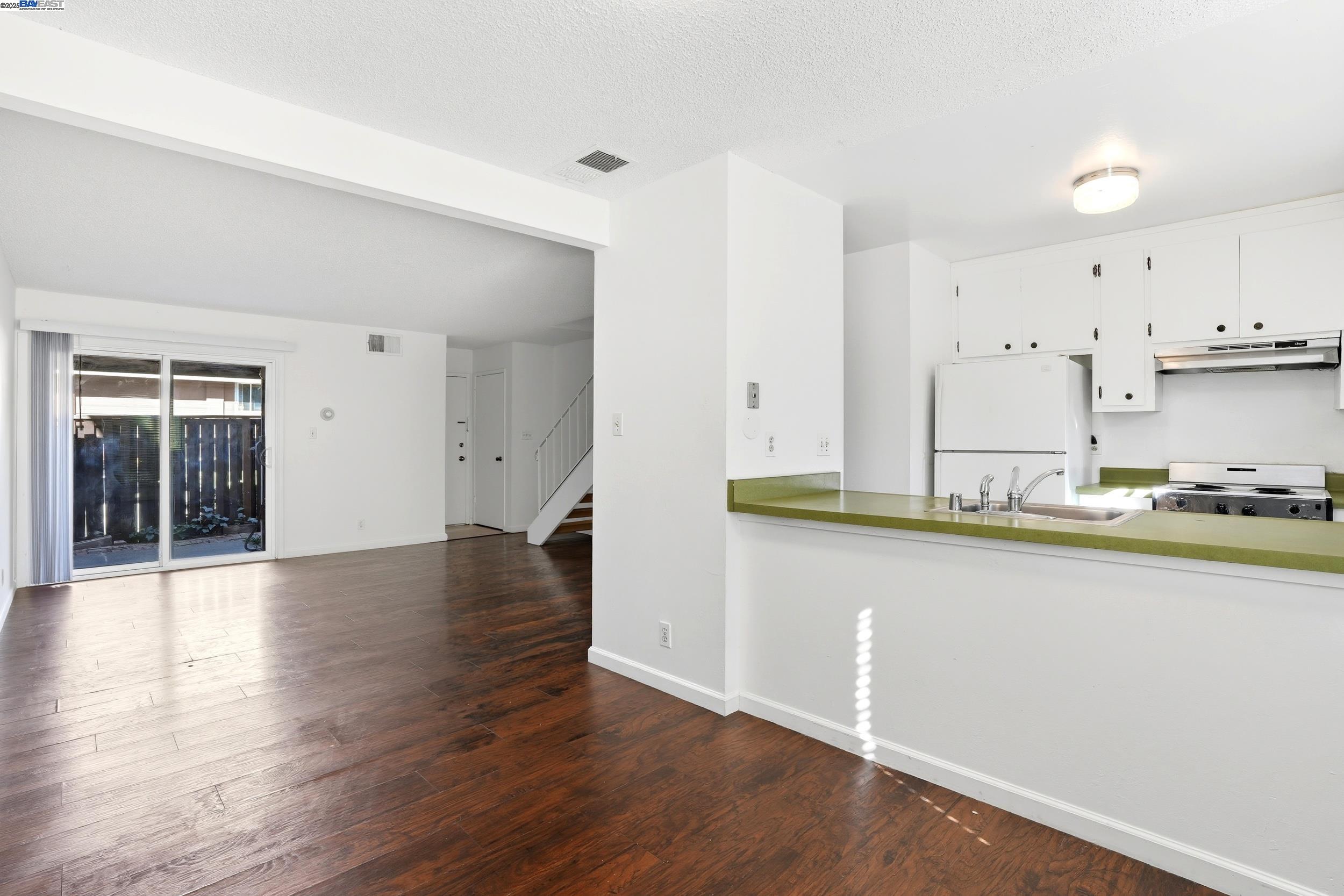 2067 Olivera Road, Unit B Concord, CA 94520 - Photo 4 of 23 a view of a kitchen with wooden floor