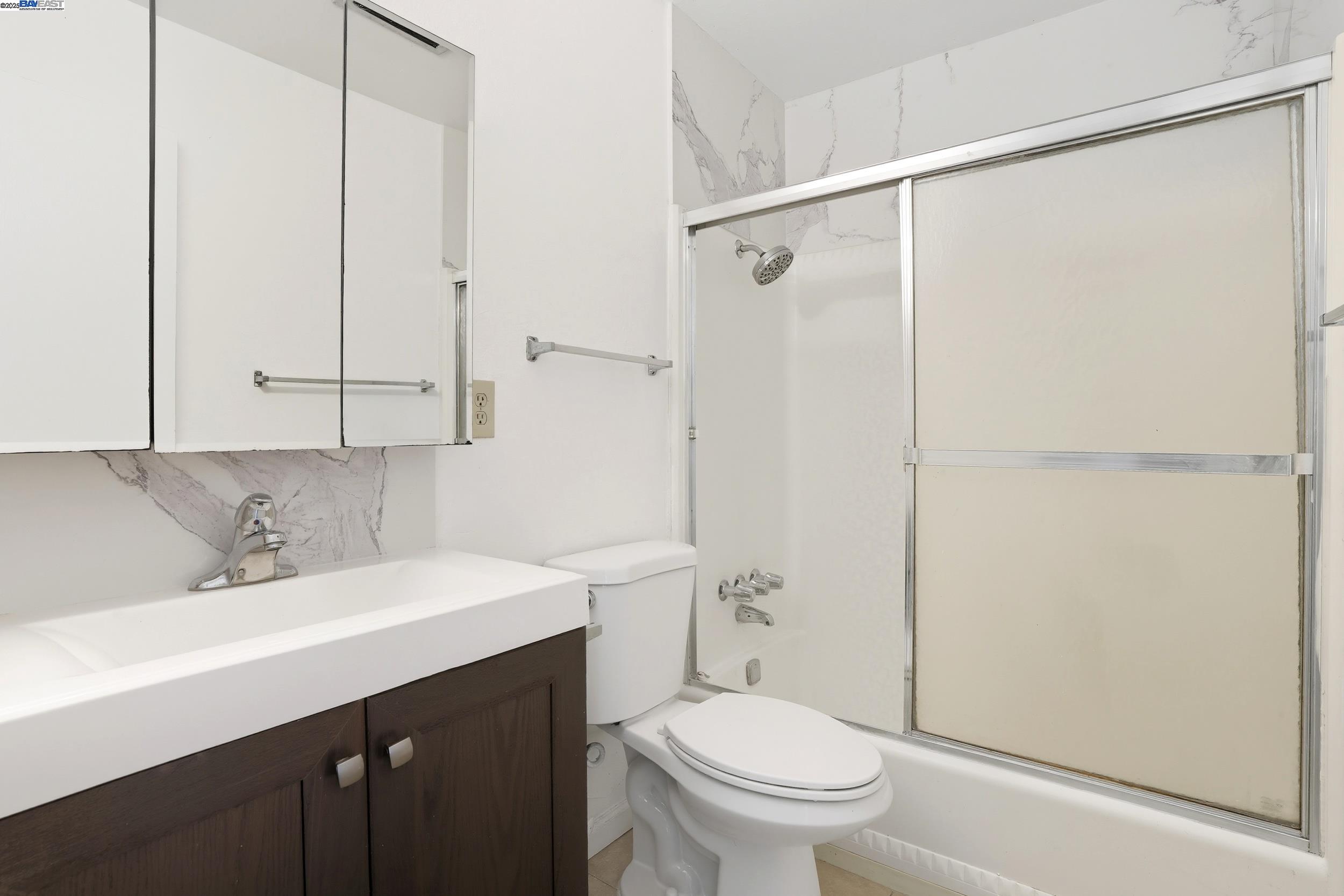 2067 Olivera Road, Unit B Concord, CA 94520 - Photo 10 of 23 a bathroom with a sink toilet and shower