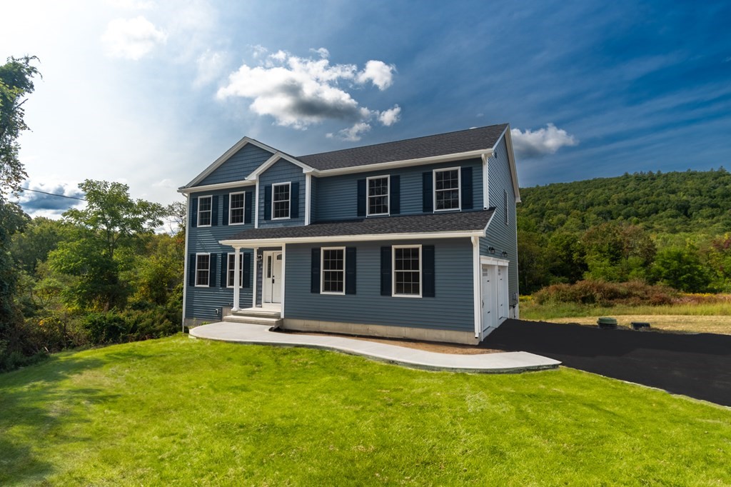 2 Upper Palmer Road Monson, MA 01057 - Photo 2 of 41 a front view of a house with a yard