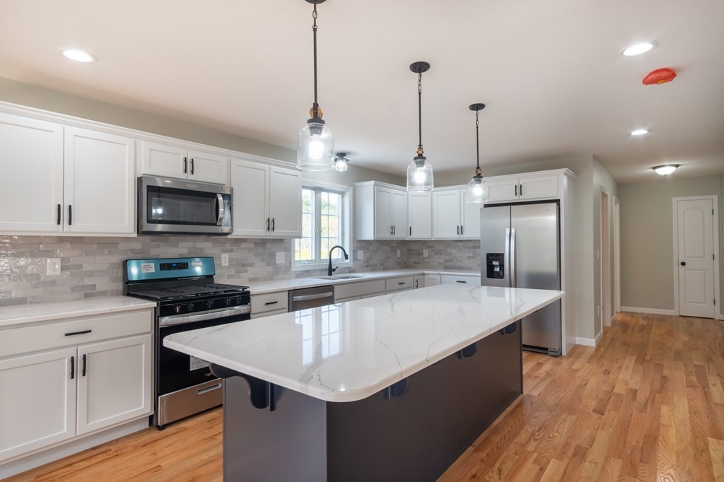 2 Upper Palmer Road Monson, MA 01057 - Photo 3 of 41 a kitchen with a center island appliances and cabinets