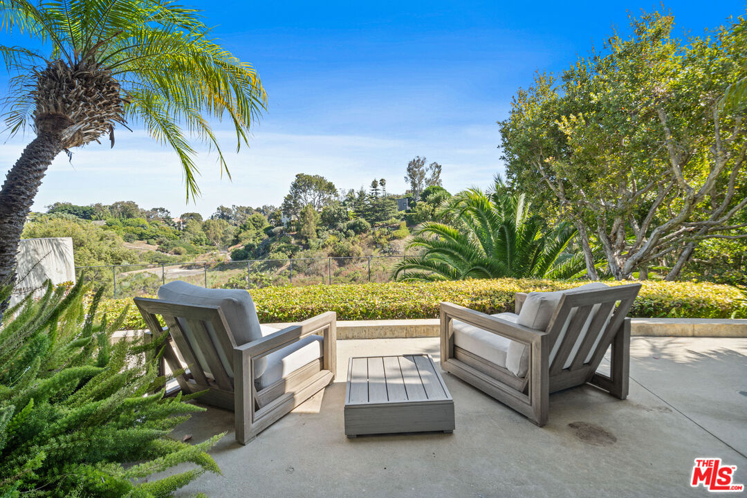 28775 Sea Ranch Way Malibu, CA 90265 - Photo 18 of 21 a view of a chairs and table in the patio