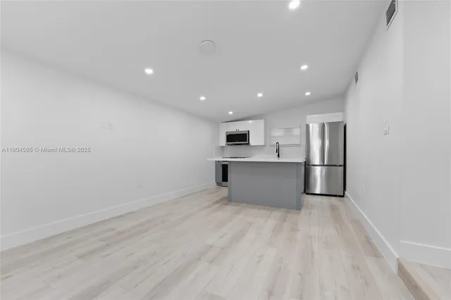 a view of kitchen with wooden floor