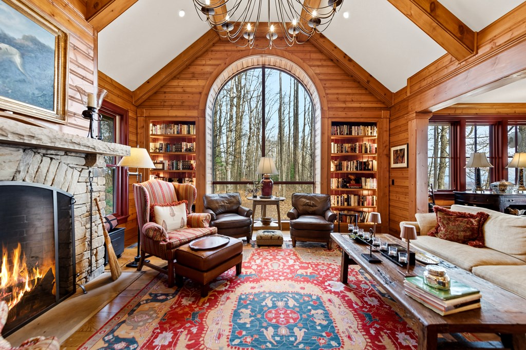 1115 Outlook Road Murphy, NC 28906 - Photo 4 of 60 a living room with furniture a fireplace and large windows
