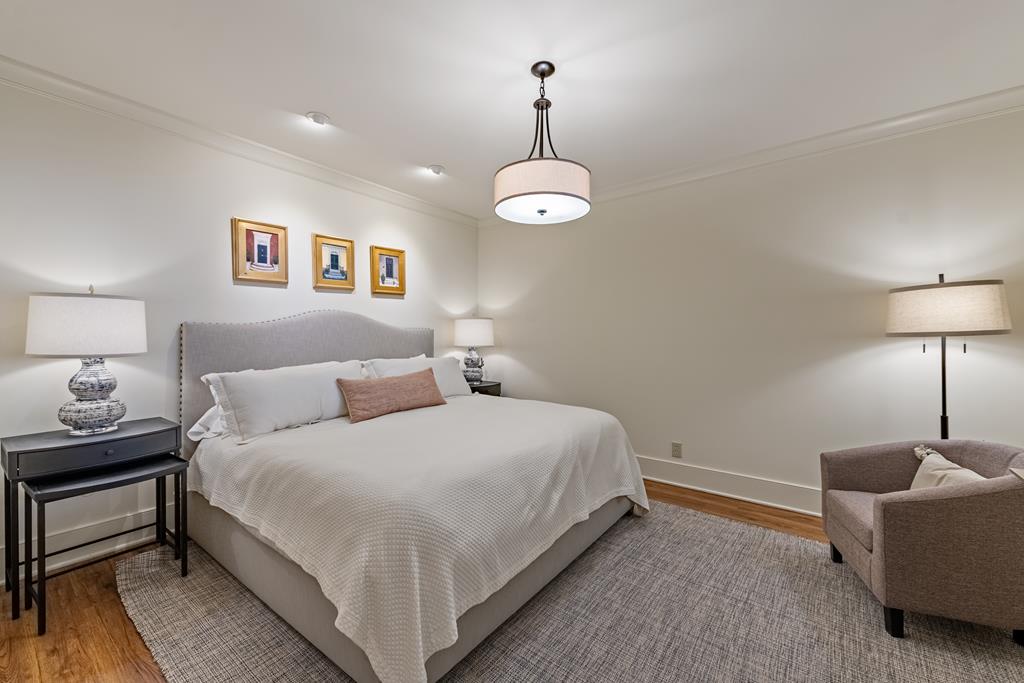 1115 Outlook Road Murphy, NC 28906 - Photo 46 of 60 a bedroom with a bed and a chandelier