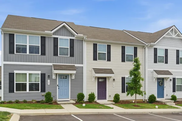 a front view of a house with a yard