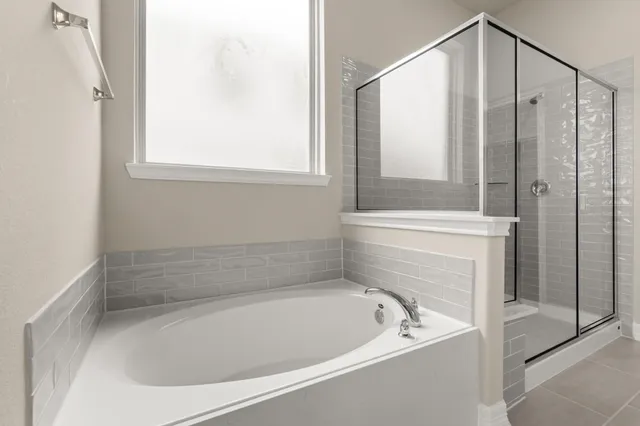 a bath tub sitting next to a window