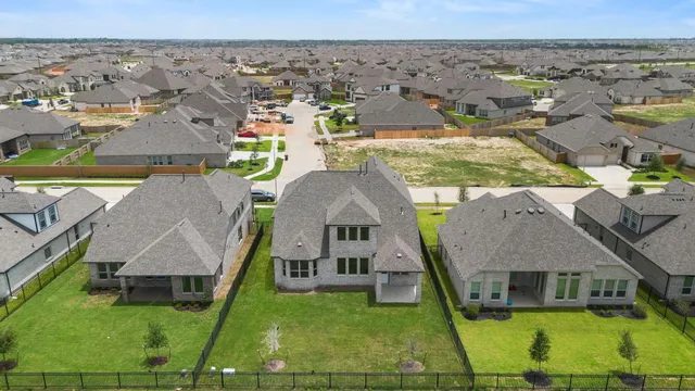 an aerial view of a house with a garden