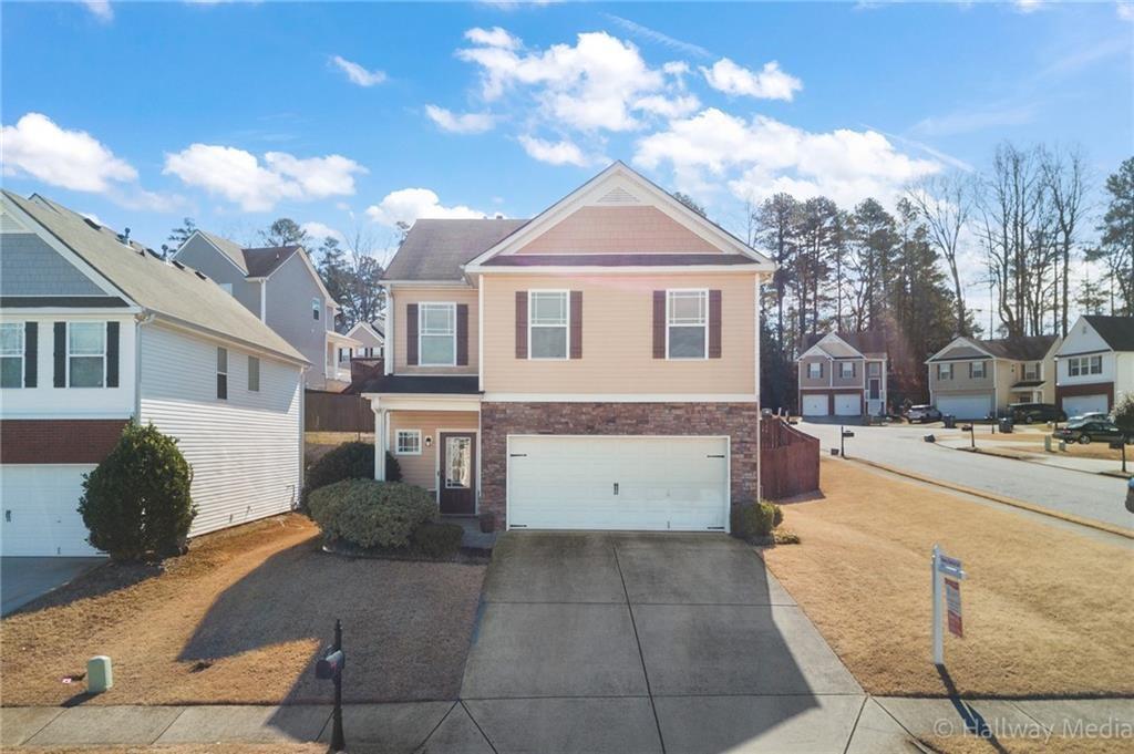 857 Crested Hawk Trail Sugar Hill, GA 30518 - Photo 1 of 1 a view of a white house with a yard