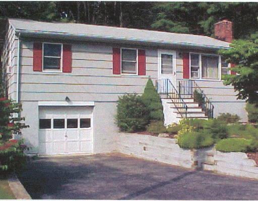 9 Victor Drive Ridgefield, CT 06877 - Photo 1 of 1 a front view of a house with a yard