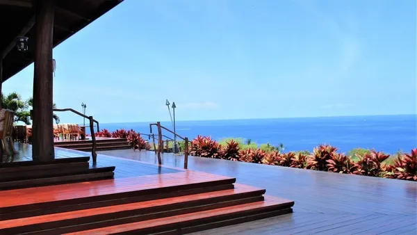 an outdoor space with furniture and garden