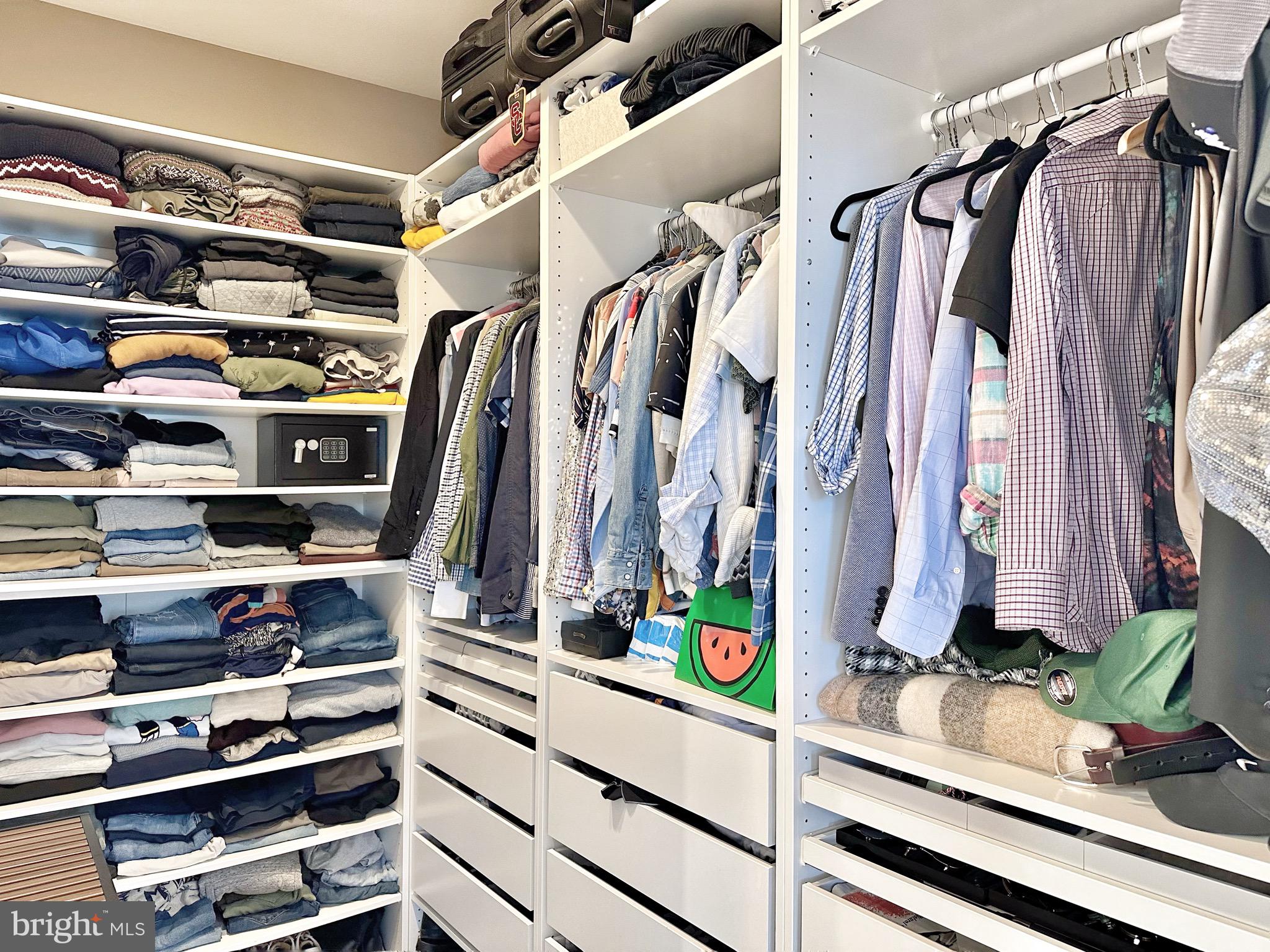 85 R Street Northwest Washington, DC 20001 - Photo 18 of 29 a view of walk in closet with clothes and shoes