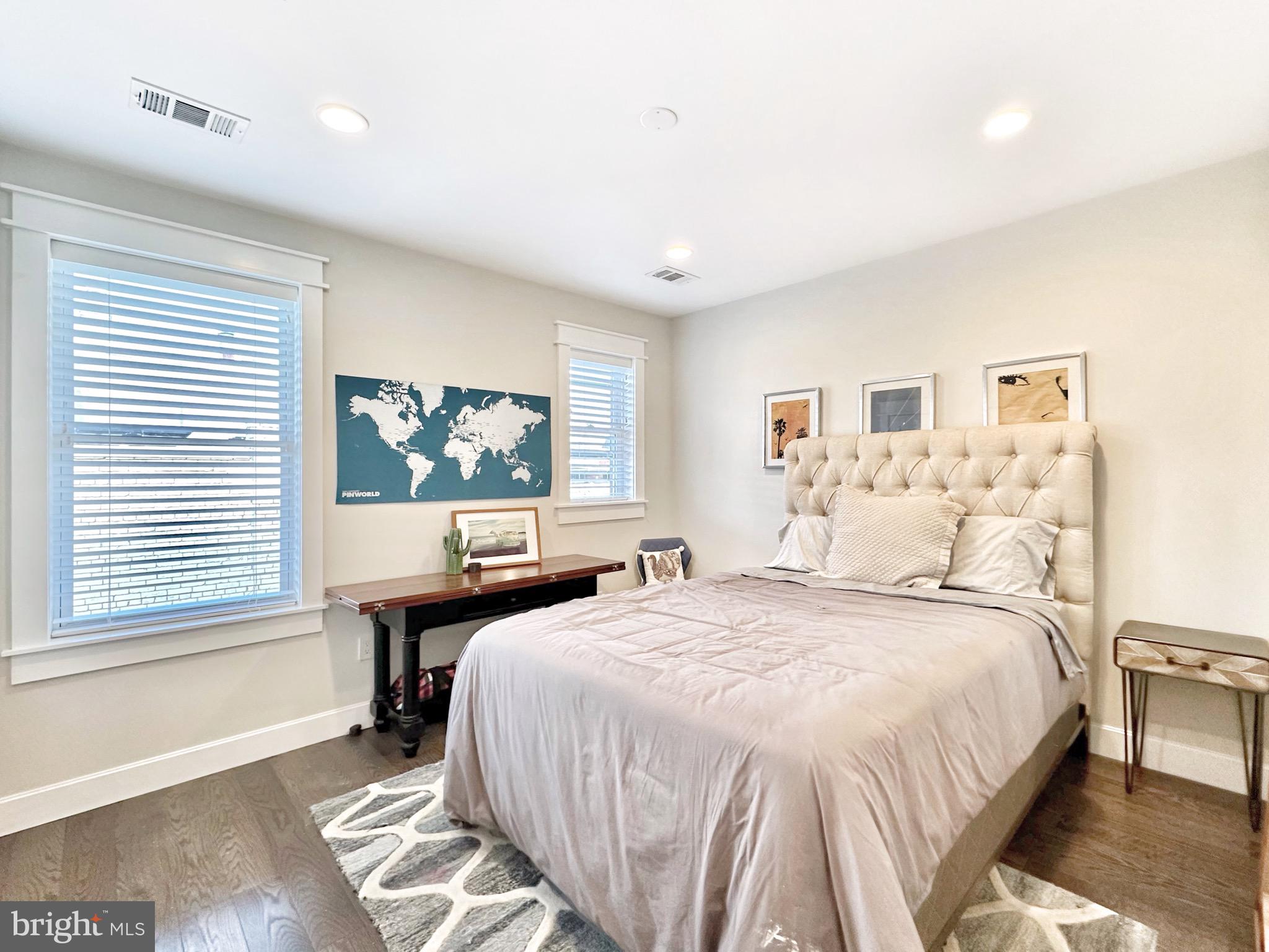 85 R Street Northwest Washington, DC 20001 - Photo 23 of 29 a bedroom with a bed and a large window