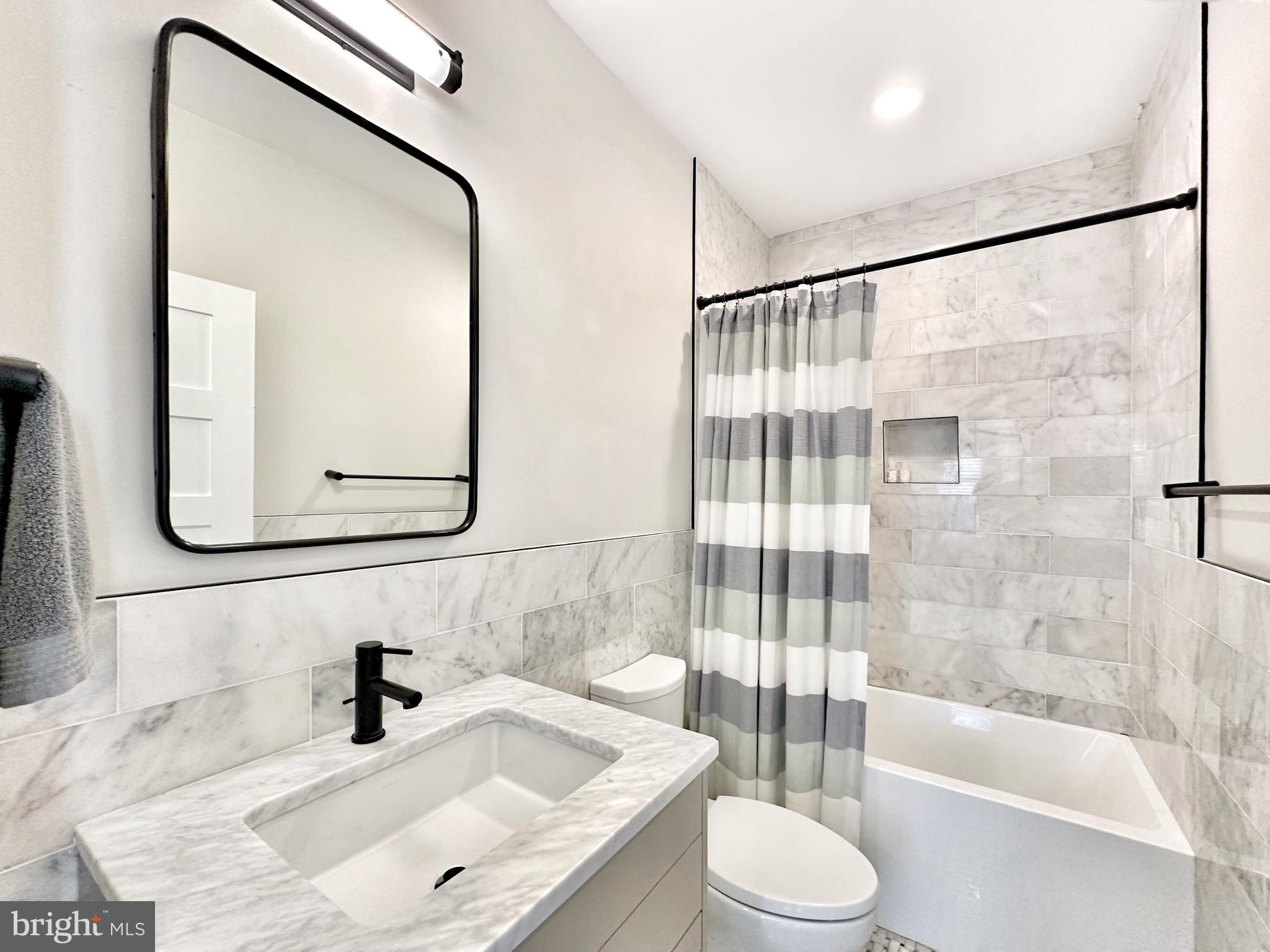 85 R Street Northwest Washington, DC 20001 - Photo 24 of 29 a bathroom with a sink toilet and shower