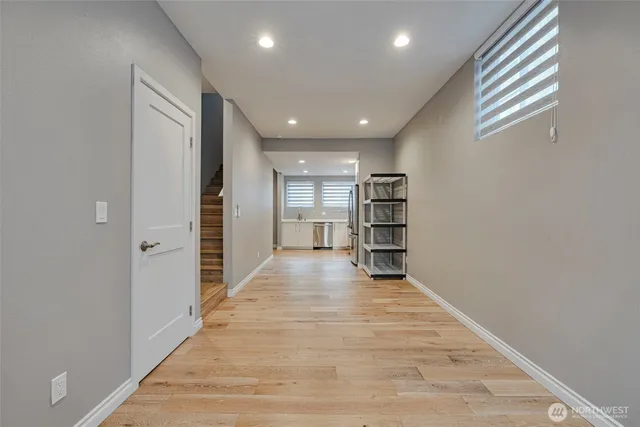 a view of a big room with closet and windows