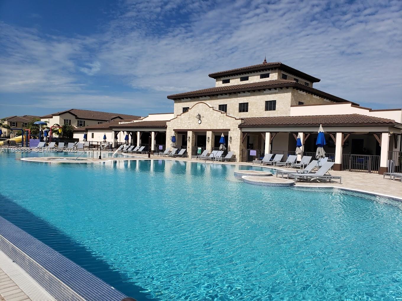 16735 Southwest 95th Street, Unit STUDIO Miami, FL 33196 - Photo 6 of 9 a front view of a house with swimming pool