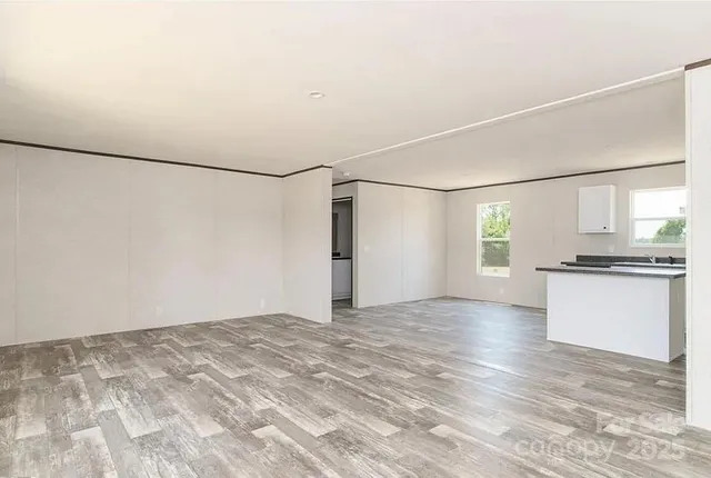 a view of a kitchen with a dishwasher and a refrigerator