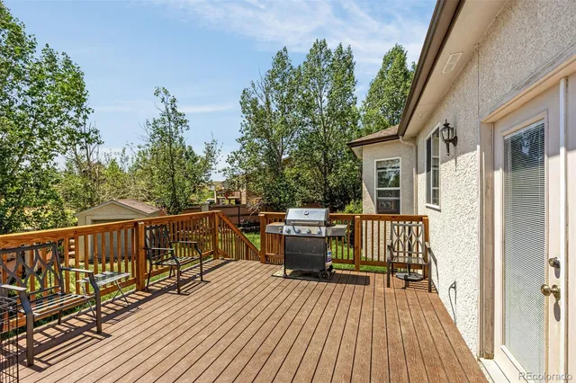 a view of balcony with deck and wooden floor