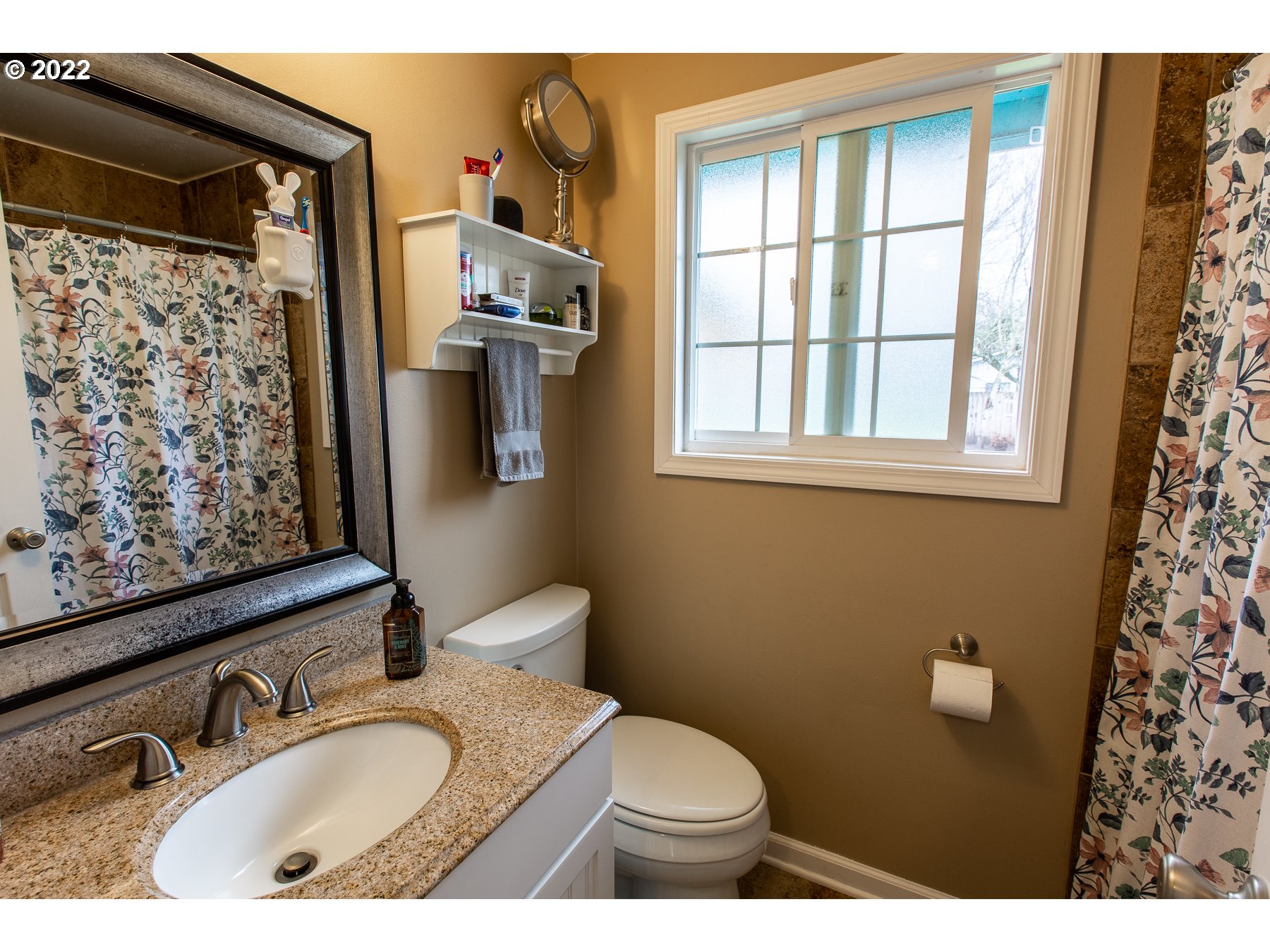 2265 10th Street Springfield, OR 97477 - Photo 14 of 23 a bathroom with a sink toilet and shower