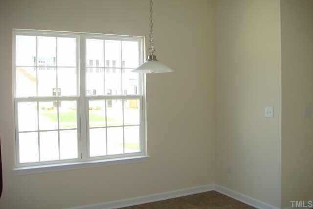 3527 Oneonta Avenue Raleigh, NC 27604 - Photo 5 of 6 an empty room with a window