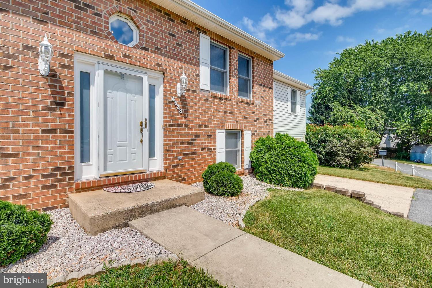 4628 Old Court Road Baltimore, MD 21208 - Photo 3 of 28 a front view of a house with garden