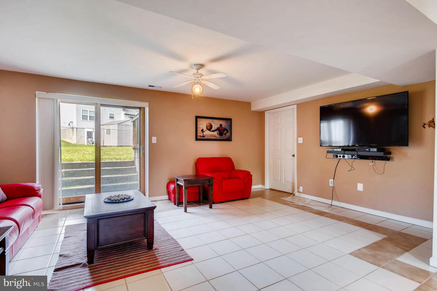4628 Old Court Road Baltimore, MD 21208 - Photo 21 of 28 a living room with furniture and a flat screen tv