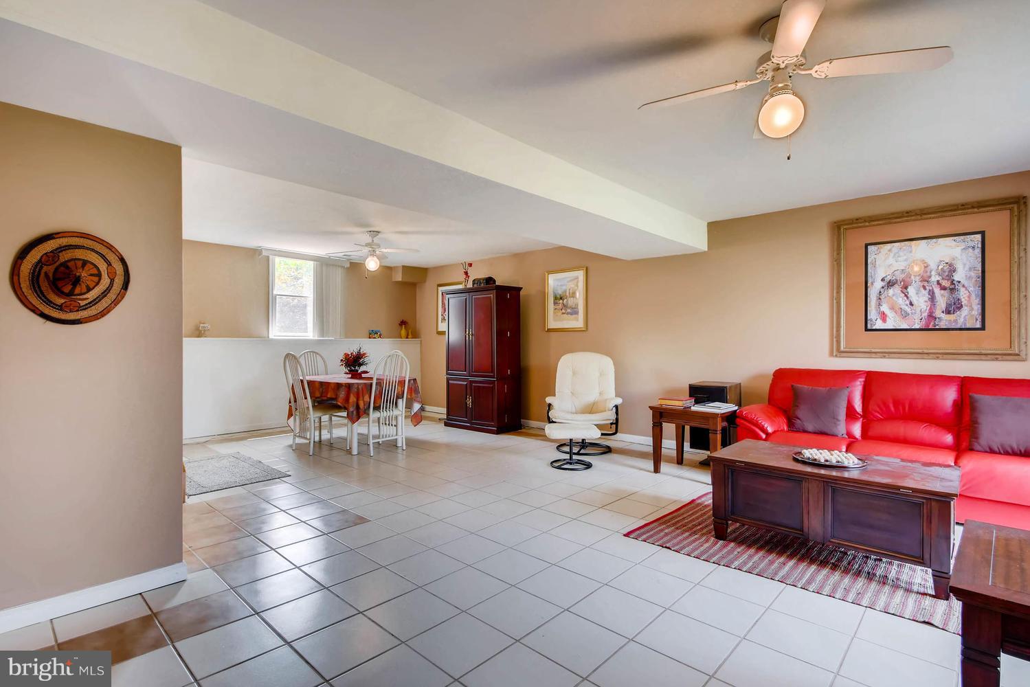 4628 Old Court Road Baltimore, MD 21208 - Photo 22 of 28 a living room with furniture and a clock