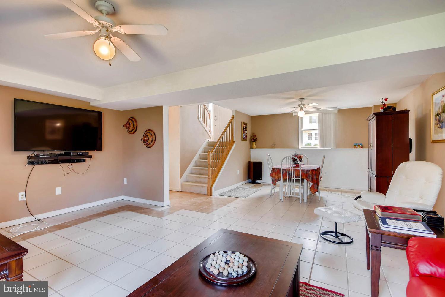 4628 Old Court Road Baltimore, MD 21208 - Photo 23 of 28 a living room with furniture and a flat screen tv