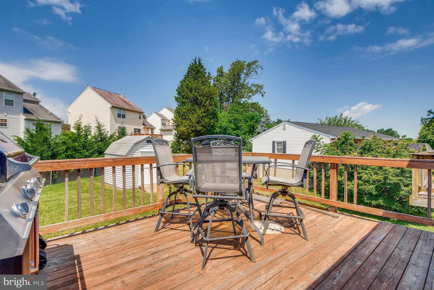 4628 Old Court Road Baltimore, MD 21208 - Photo 25 of 28 a view of a chair and table on the wooden deck