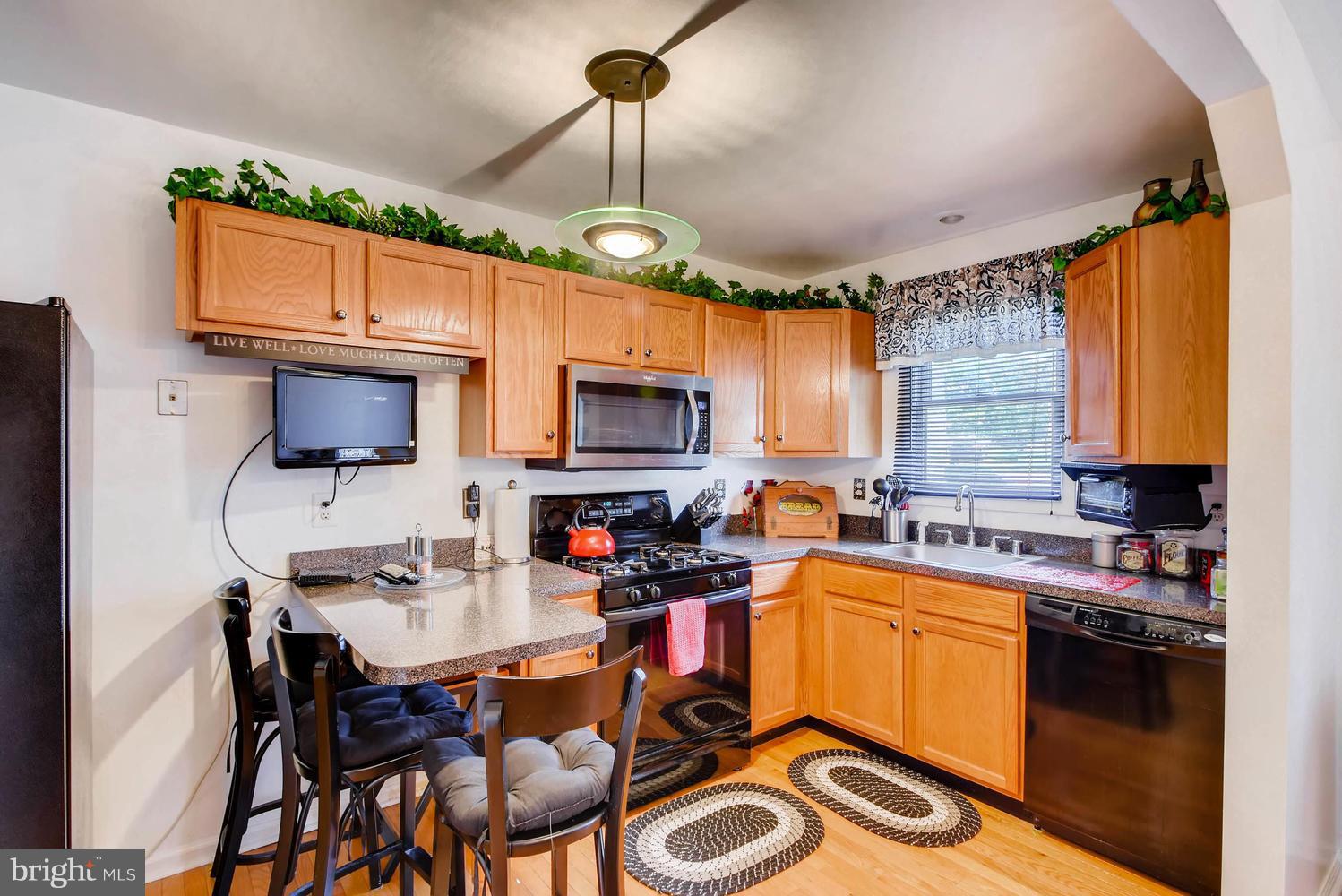 4628 Old Court Road Baltimore, MD 21208 - Photo 10 of 28 a kitchen with a sink appliances and cabinets
