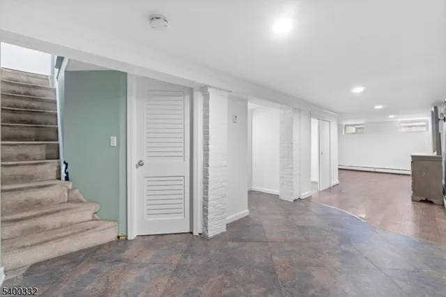 a view of an empty room with a fireplace