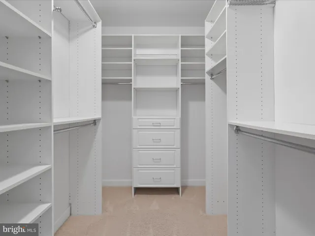 a bathroom with a sink vanity and a mirror