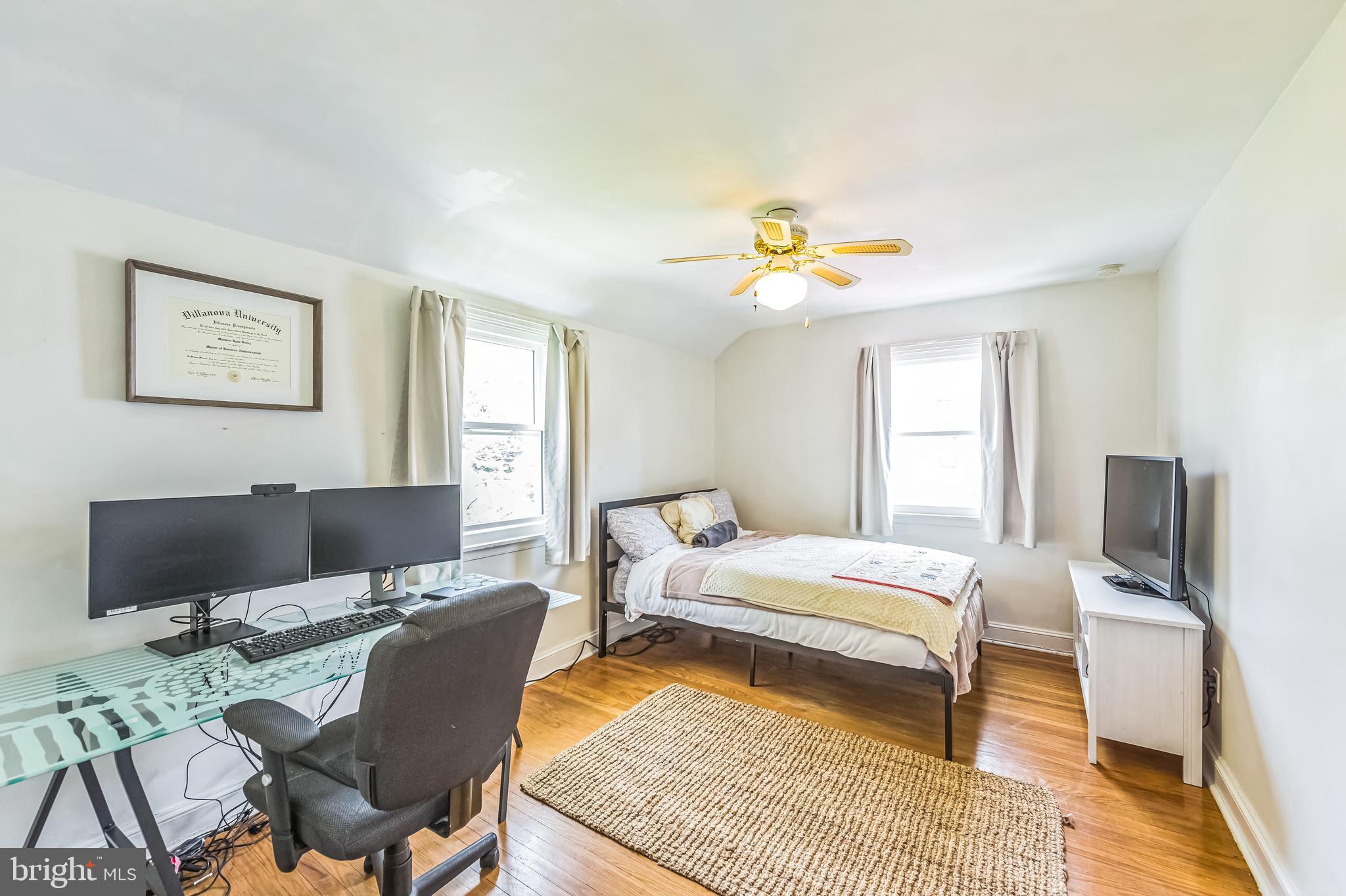 111 East Manoa Road Havertown, PA 19083 - Photo 12 of 18 a bedroom with a bed and wooden floor