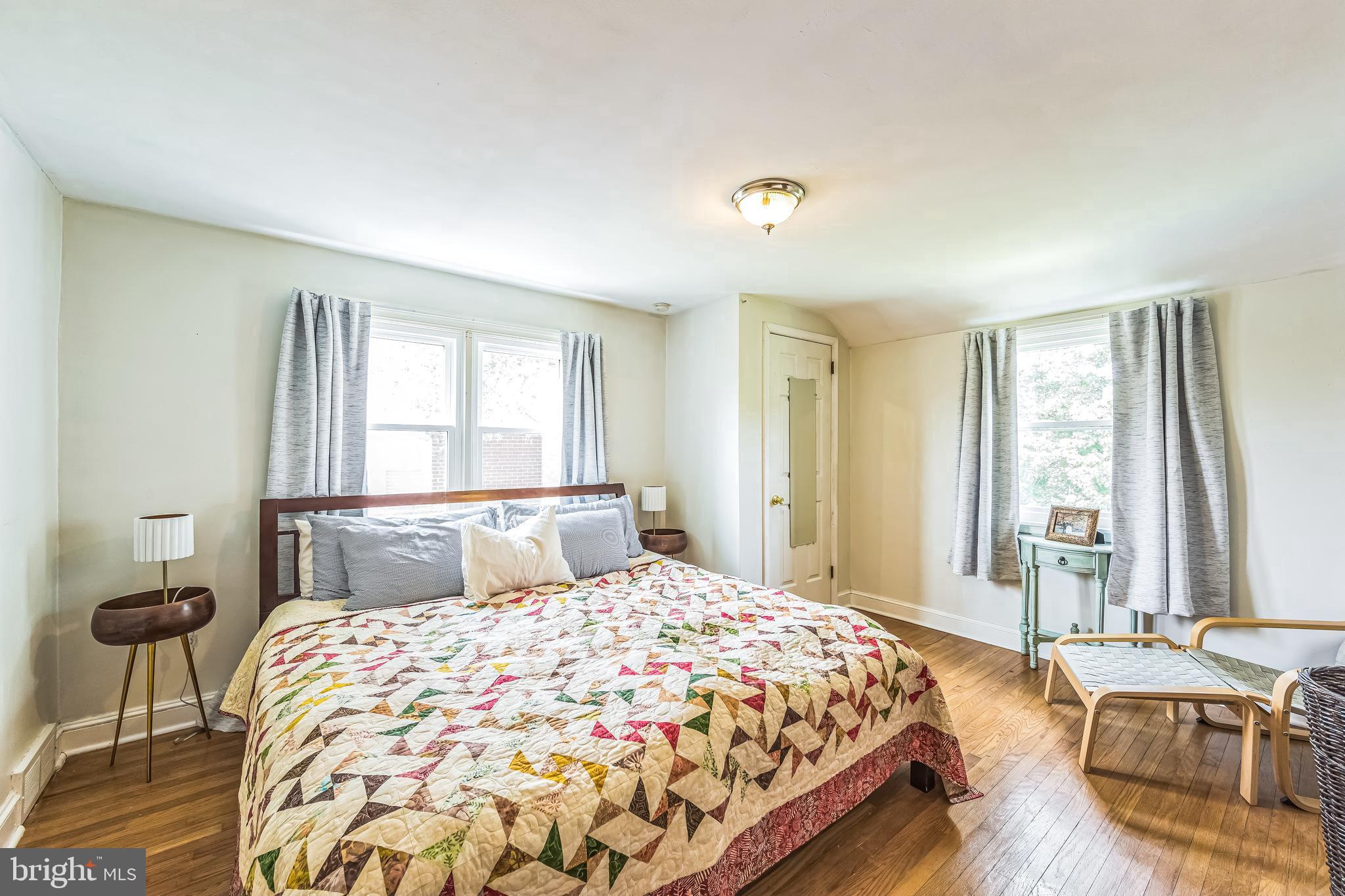 111 East Manoa Road Havertown, PA 19083 - Photo 13 of 18 a bedroom with a large bed and a window