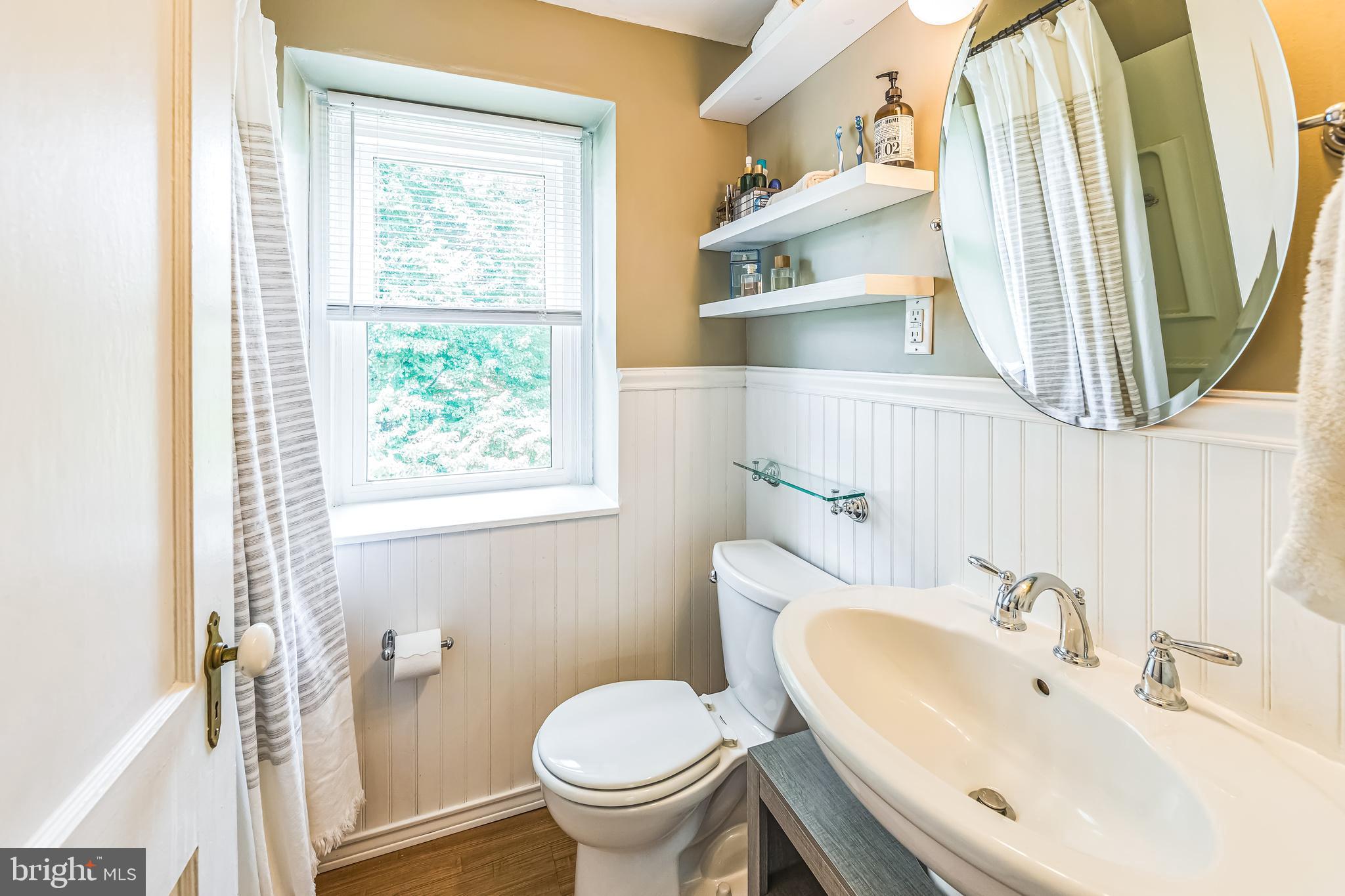 111 East Manoa Road Havertown, PA 19083 - Photo 14 of 18 a bathroom with a sink and a mirror