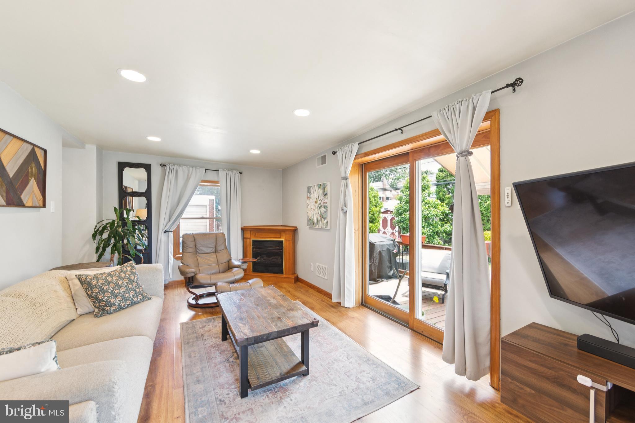 111 East Manoa Road Havertown, PA 19083 - Photo 7 of 18 a living room with furniture and a floor to ceiling window