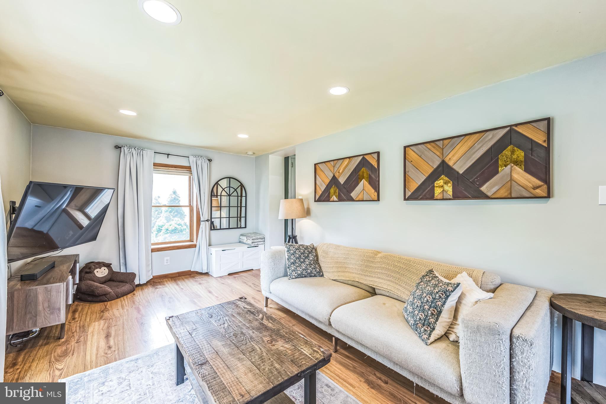 111 East Manoa Road Havertown, PA 19083 - Photo 8 of 18 a living room with furniture and a window