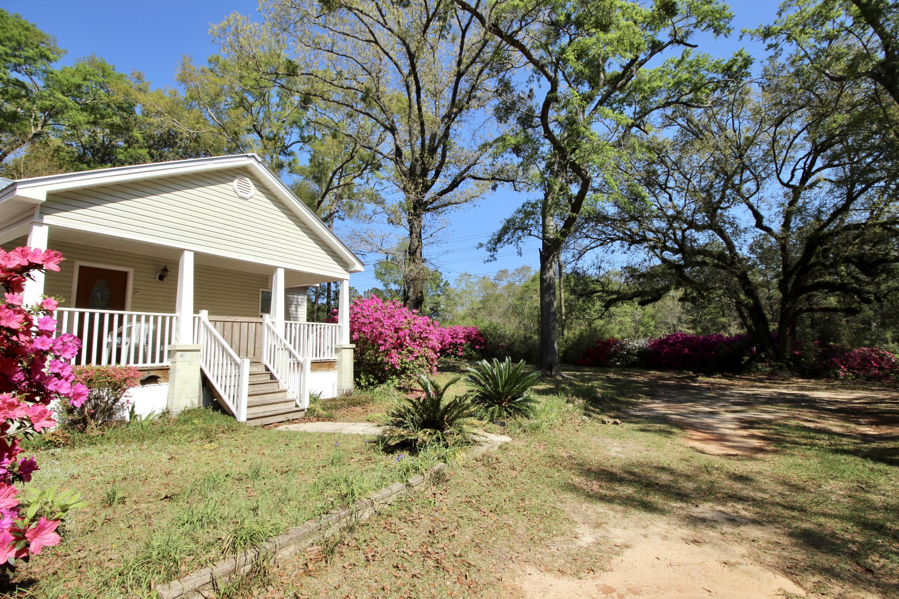 36 Williams Road DeFuniak Springs, FL 32433 - Photo 11 of 40 a view of a house with a yard