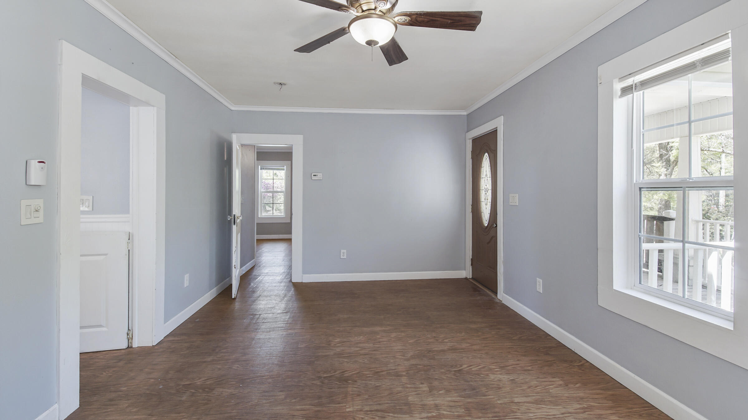 36 Williams Road DeFuniak Springs, FL 32433 - Photo 16 of 40 a view of an entryway with wooden floor and a ceiling fan