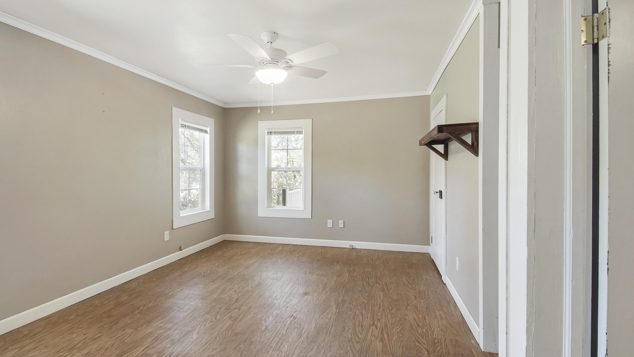 36 Williams Road DeFuniak Springs, FL 32433 - Photo 20 of 40 wooden floor in an empty room with a window