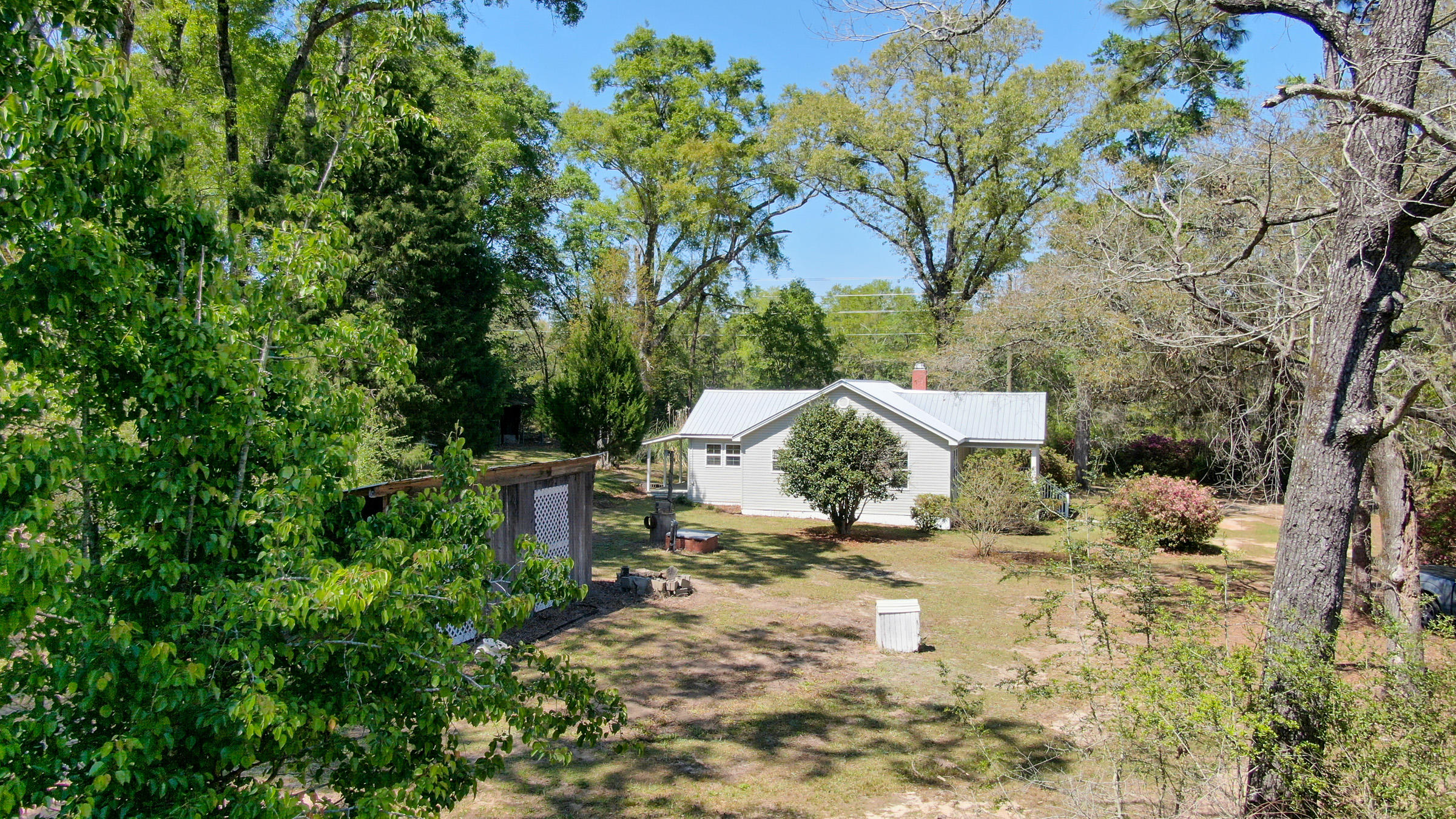 36 Williams Road DeFuniak Springs, FL 32433 - Photo 31 of 40 a view of a house with a yard