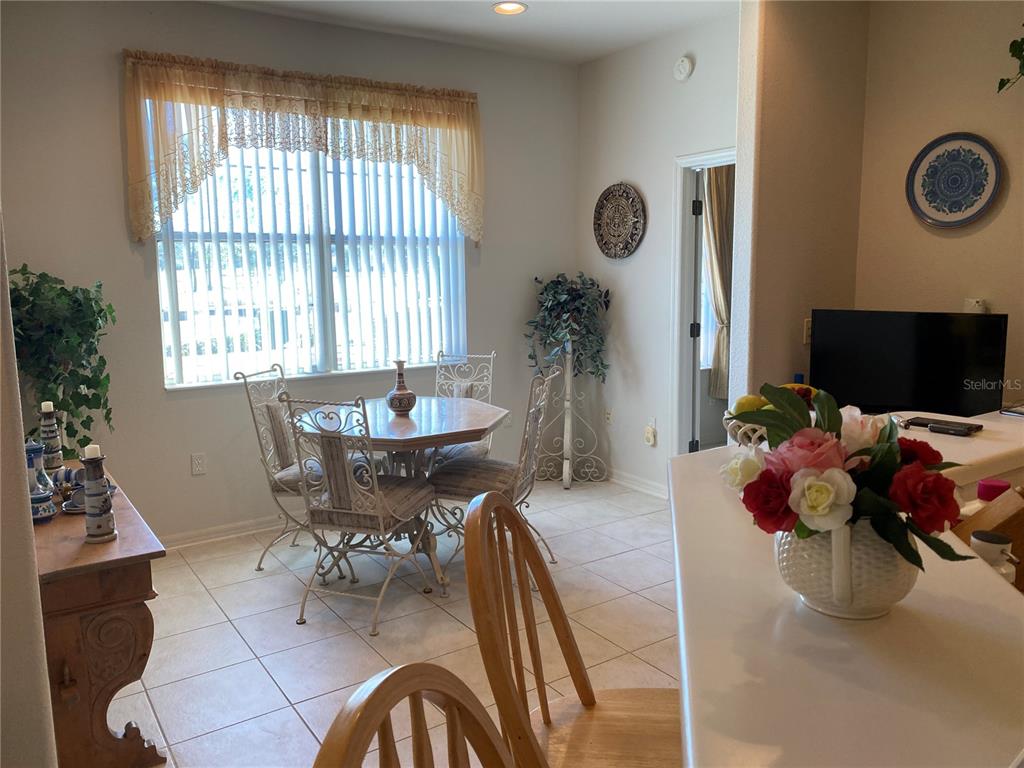 8464 Southwest 82nd Circle Ocala, FL 34481 - Photo 12 of 47 a living room with furniture and a flat screen tv