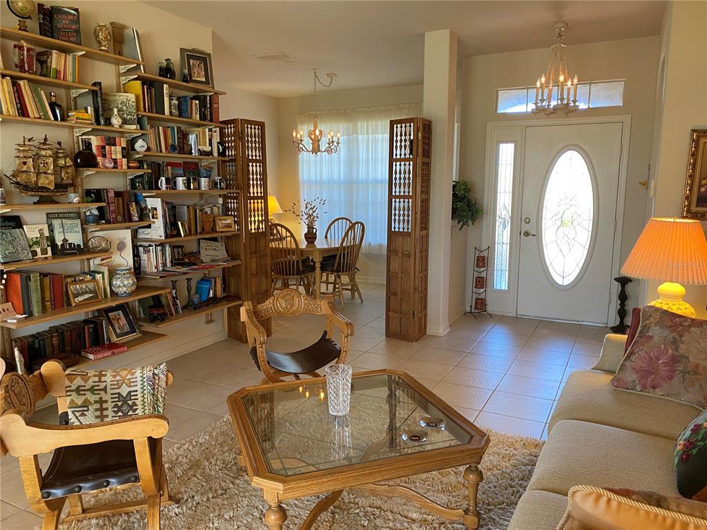 8464 Southwest 82nd Circle Ocala, FL 34481 - Photo 15 of 47 a living room with lots of furniture and a wooden floor