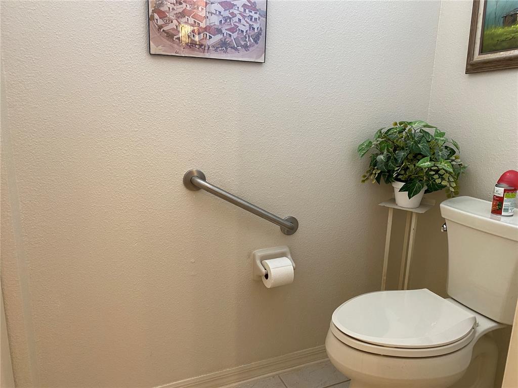 8464 Southwest 82nd Circle Ocala, FL 34481 - Photo 21 of 47 a white toilet sitting next to a shower