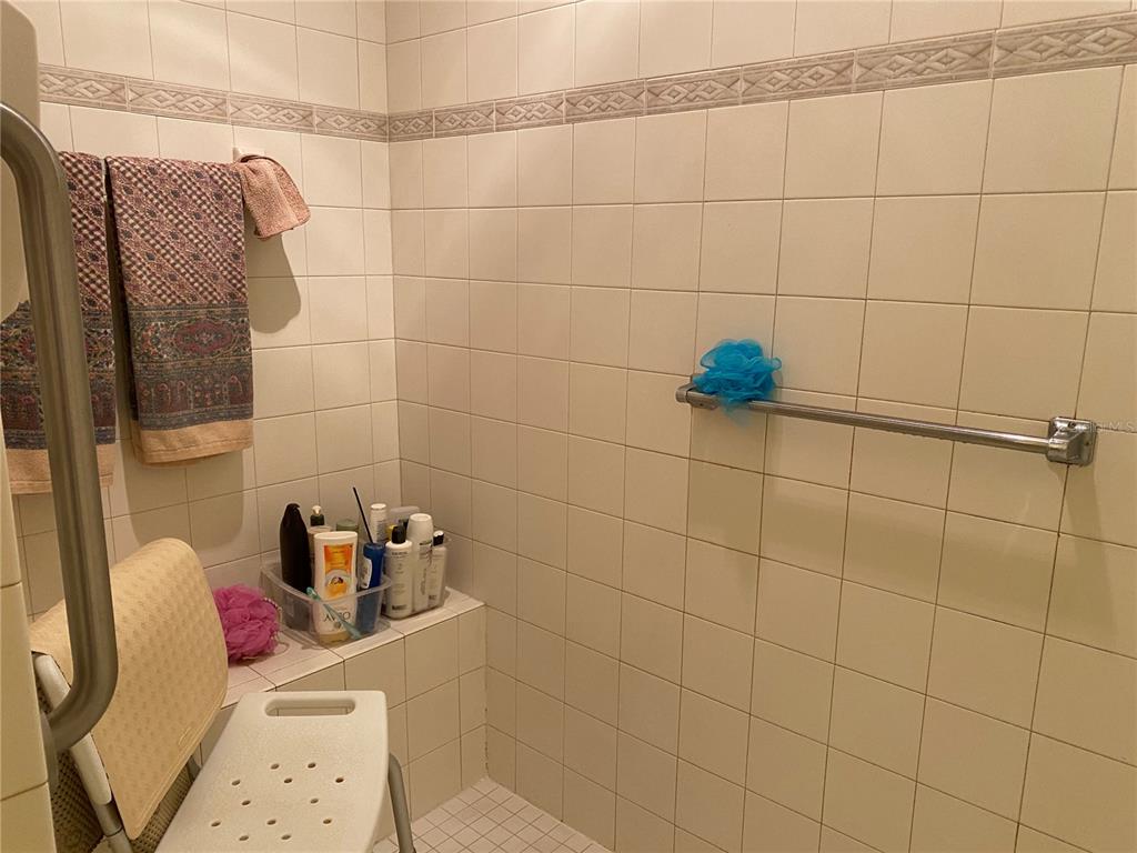 8464 Southwest 82nd Circle Ocala, FL 34481 - Photo 23 of 47 a bathroom with a sink and a shower