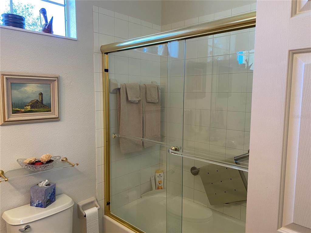 8464 Southwest 82nd Circle Ocala, FL 34481 - Photo 25 of 47 a bathroom with a shower and toilet
