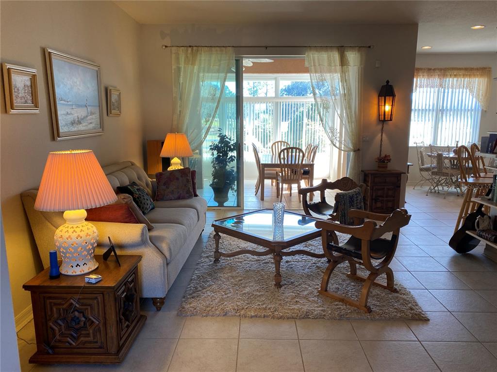 8464 Southwest 82nd Circle Ocala, FL 34481 - Photo 3 of 47 a living room with furniture and a large window